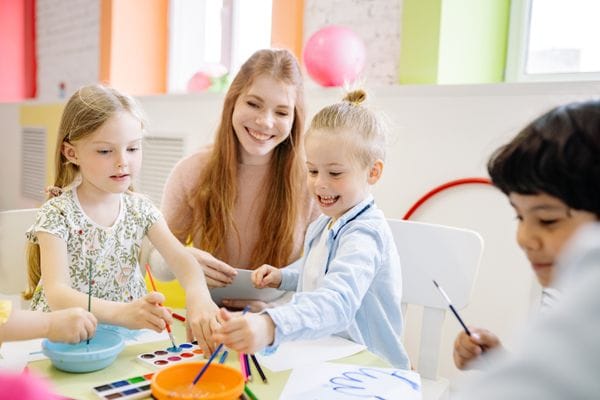 Preschool children engaged in reading and literacy activities
