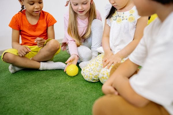Young children practicing writing and letter formation